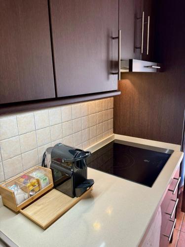 a kitchen counter with a toaster on a counter top at G5 Realejo apartment in Granada