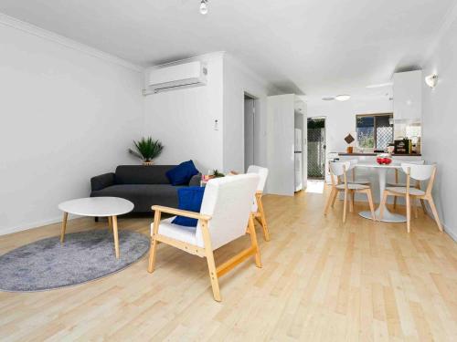 a living room with a couch and a table at Beach Getaway Villa 2BR Fun! in Bicton