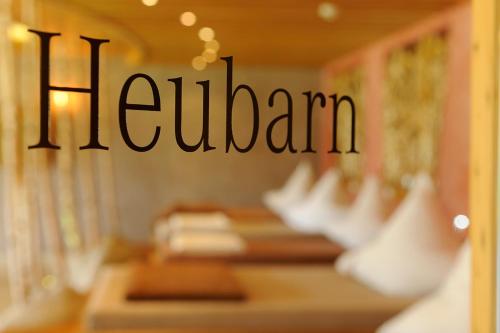 a sign that reads harajarin in a row of tables at Hotel Heselbacher Hof in Baiersbronn