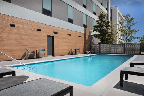 a swimming pool in front of a building at Home2 Suites by Hilton Clarksville/Ft. Campbell in Clarksville