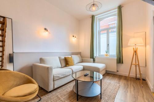 O zonă de relaxare la Maison 3 chambres avec jardin, proche tram