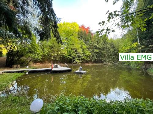 a couple of boats on a lake with trees at Familien Gruppen Villa EMG Osnabrück Bielefeld - Preußisch-Oldendorf in Preußisch Oldendorf