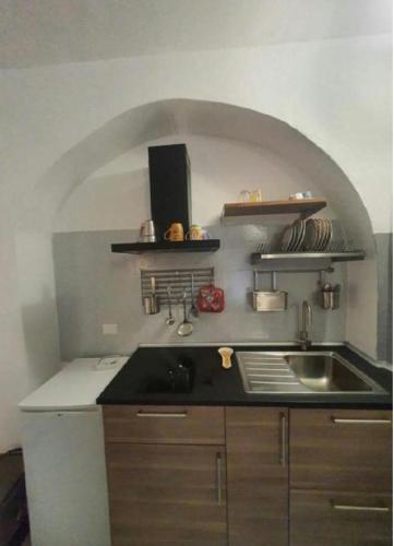 a kitchen with a sink and a counter top at Casa caterina in Corniglia