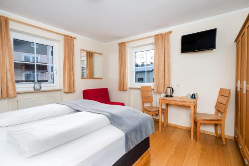 Postel nebo postele na pokoji v ubytování Hotel Tauernglöckl