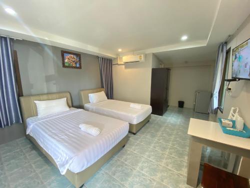 Katil atau katil-katil dalam bilik di บุรีสอร์ต บุรีรัมย์ Burisort Burirum