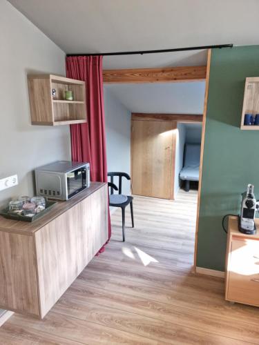 Kuchyň nebo kuchyňský kout v ubytování vakantiehuis en appartement De Harscamp