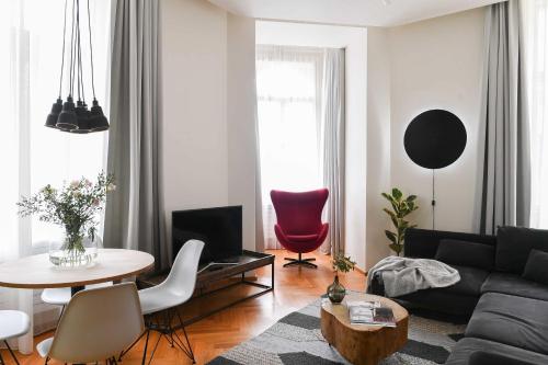 a living room with a couch and a table at Masarykova N°30 in Brno