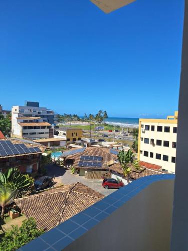 a view of the beach from a balcony of a building at Cobertura Duplex Na Praia Dos Milionários in Ilhéus