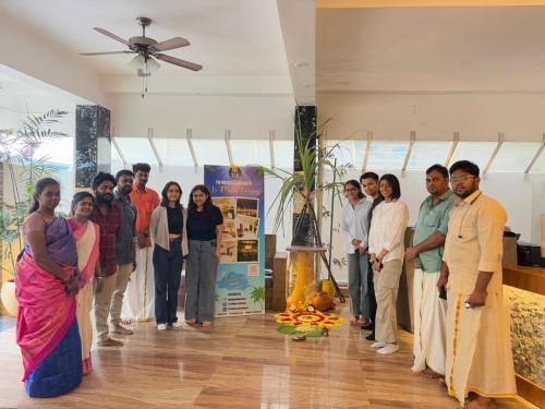 a group of people posing for a picture in a room at Le Poshe Luxury - TIE Hotels & Resorts in Puducherry