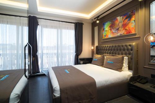 Postel nebo postele na pokoji v ubytování La Cielo Hotel Bostancı