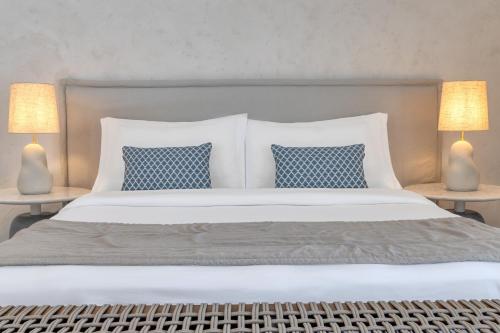A bed or beds in a room at Patmos Aktis, a Luxury Collection Resort & Spa, Greece