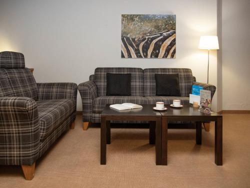 Un lugar para sentarse en Apartment Chalet Abendrot apARTments-17 by Interhome