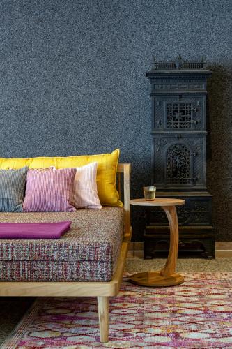 a living room with a couch and a table at Hotel am Haslinger Hof in Bad Füssing