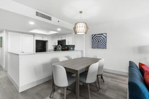 a kitchen and dining room with a table and chairs at Compass Cove in Myrtle Beach