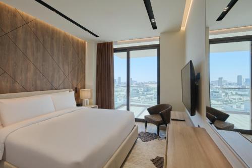 Una cama o camas en una habitación de The OQ