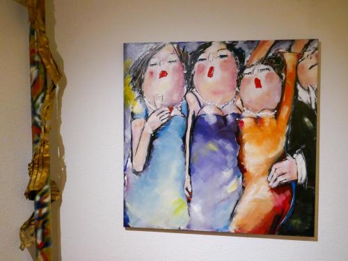 a painting of three women sitting on a couch at Apartment Chalet Abendrot apARTments-30 by Interhome in Grindelwald