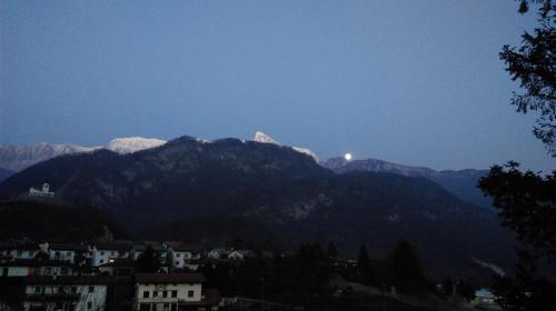 a view of a mountain range with snow covered mountains at Studio Brnat in Kobarid
