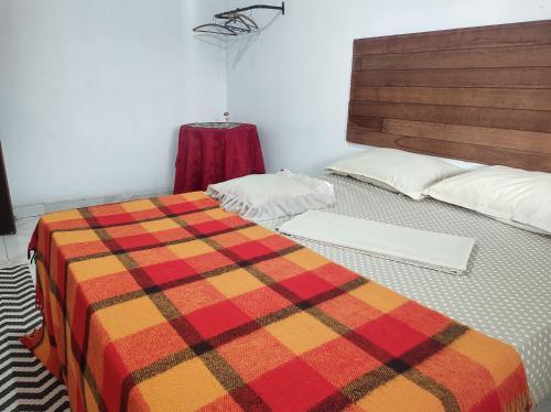 Katil atau katil-katil dalam bilik di Mi Casa Rio Garagem Wi-Fi Grátis Próximo Praia Barra