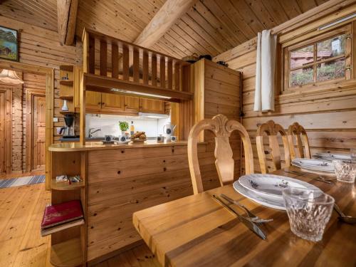 a dining room with a table and chairs in a cabin at Chalet Fjordblick I by Interhome in Olden