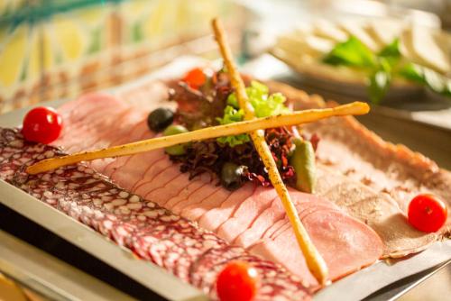 a plate of food with meat and vegetables on it at Park-Hotel Golosievo in Kyiv