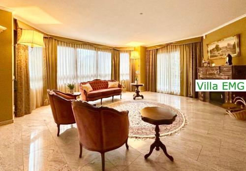 a living room with a couch and a table at Luxury Spa Villa EMG Karlsruhe Baden-Baden Rastatt - Gernsbach in Gernsbach