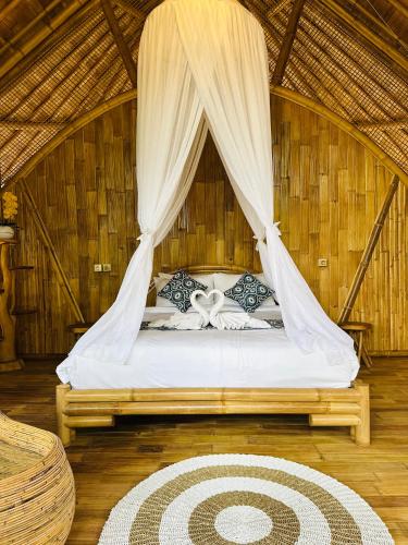 Ένα ή περισσότερα κρεβάτια σε δωμάτιο στο Bamboo House - Ecobreeze