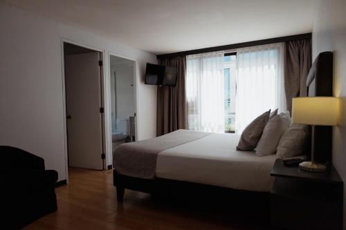 Postel nebo postele na pokoji v ubytování Tempo Rent Apart Hotel