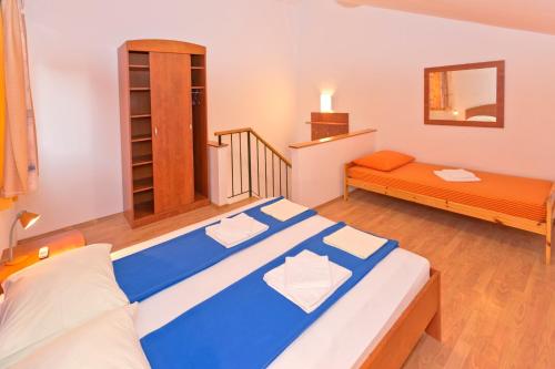 Postel nebo postele na pokoji v ubytování Apartments Nautic