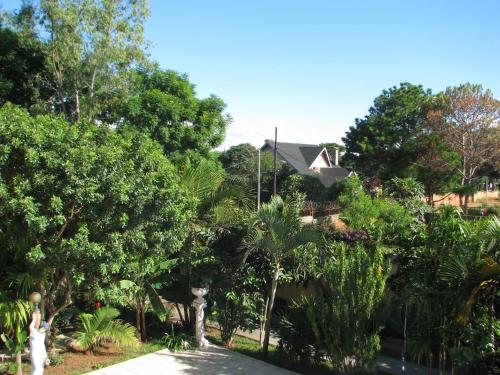 a house surrounded by trees and a driveway at Avamada Lodge in Ivato
