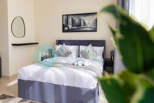 a bedroom with a bed with two stuffed animals on it at Bloomfields Magnificent Stu In View Raha Beach in Abu Dhabi
