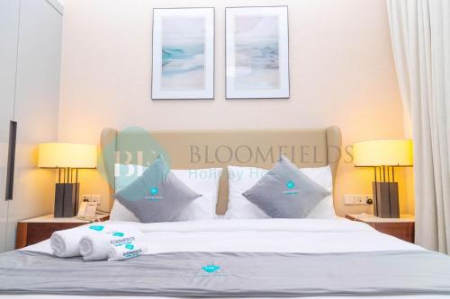 Postel nebo postele na pokoji v ubytování Bloomfields 2brmaid Address Beach Fujairah