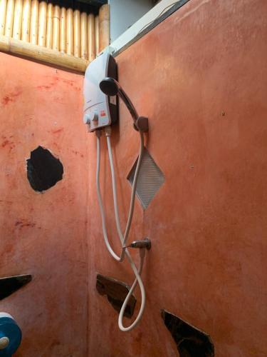 a shower on the side of a boat at Pimmada Hut in Haad Pleayleam