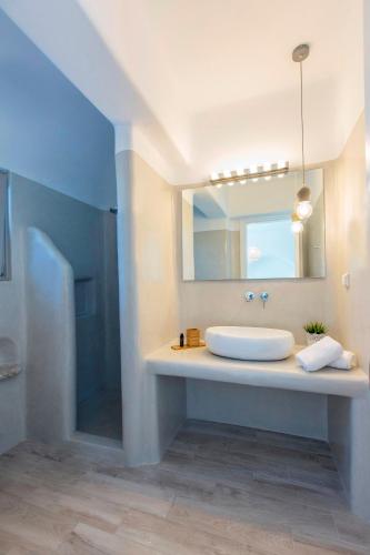 a bathroom with a sink and a mirror at Villa Rocabella Just 100m from Glyfada Beach in Kastraki