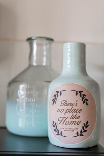 two glass bottles are sitting on a shelf at Quinta Bohemia in Moncarapacho