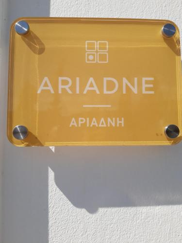 a yellow sign that reads arabanticarmaarma on a wall at Matala Prime Villas in Matala