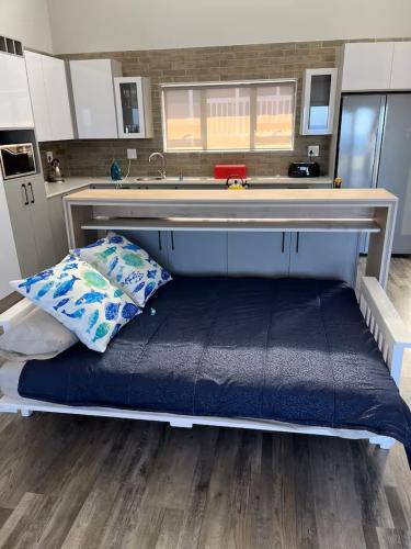 a large bed in the middle of a kitchen at Island View in Mossel Bay in Mossel Bay