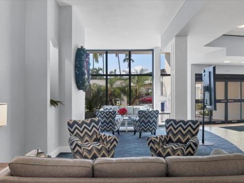 a living room with a couch and chairs at Catch of the Day at Harbor Towers on Siesta Key in Siesta Key