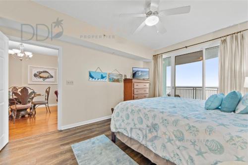 a bedroom with a bed with blue pillows at Legacy Tower Two 1202 Deluxe in Gulfport