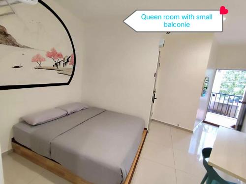 Postel nebo postele na pokoji v ubytování MUSANG ONG HOTEL