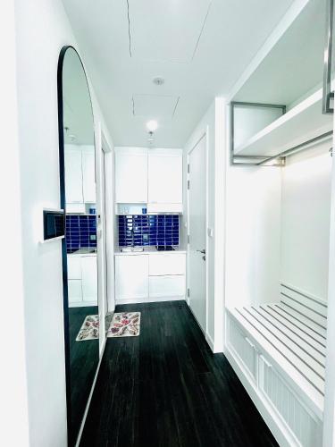 a hallway with a mirror and a dressing room at Love & Peace Apartment in Phú Quốc