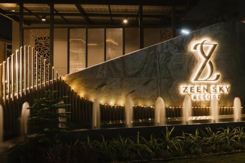 a sign for the zen sky resort at night at Zeen Sky Resort in Ban Noi