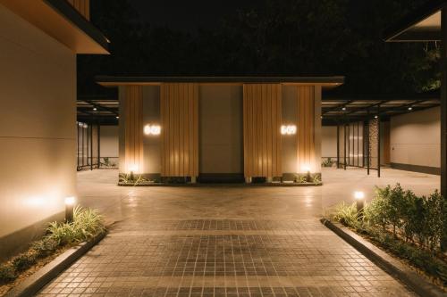 a large building with a stage at night at Zeen Sky Resort in Ban Noi
