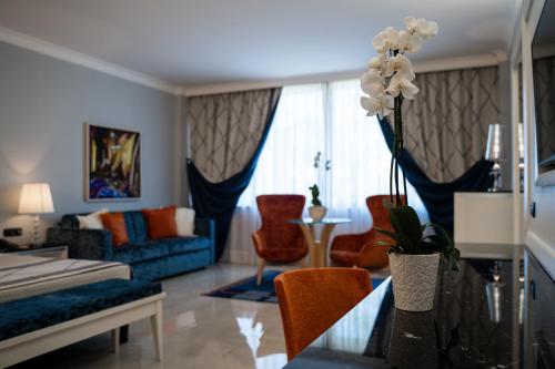 a living room with a couch and a table at Hotel Ariston in Paestum