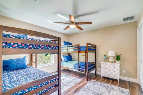 a bedroom with two bunk beds and a ceiling fan at Brooksville Home about 5 Mi to Weeki Wachee Springs! in Brooksville