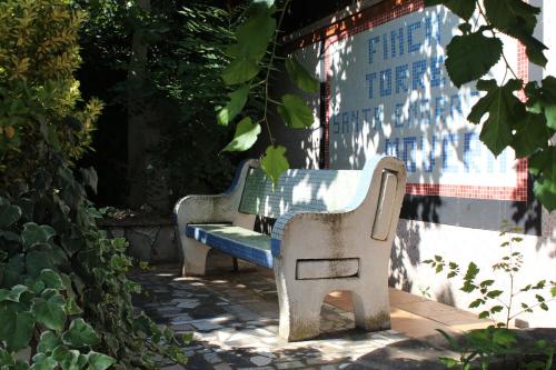 two benches sitting next to a wall at Apartamento en Zaragoza-3 in Zaragoza