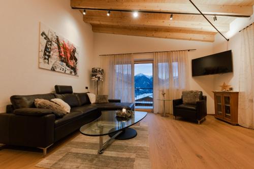 TV a/nebo společenská místnost v ubytování da Peatala Apartments