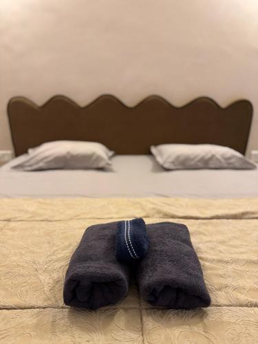 a pair of towels sitting on top of a bed at Pacho Luxe- 2 Bedroom Luxury Independent Villa in Jaipur