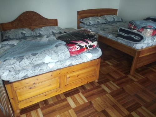 Ένα ή περισσότερα κρεβάτια σε δωμάτιο στο MOUNTAIN INN Bikash Homestay