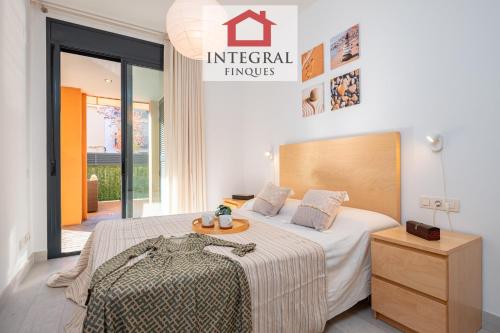 En eller flere senge i et værelse på Blue Lagoone Apartment Palamós