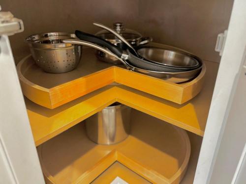 a kitchen counter with a sink and pots and pans at King Bed Suite in Conroe , Garage Available in Conroe